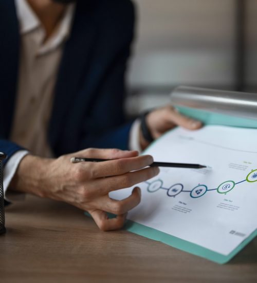 person-office-analyzing-checking-finance-graphs